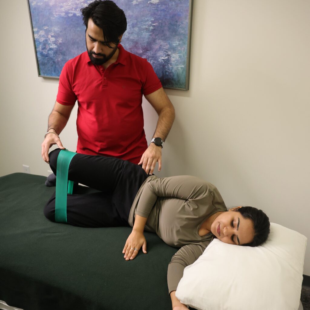 A Patient Performing A Resistance Band Exercise During A Physiotherapy Edmonton Rehabilitation Session At In Step Physical Therapy.