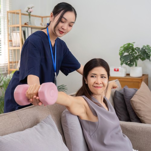 A Professional Caregiver Providing Healthcare Advice And Discussing A Treatment Plan With A Patient During A Physiotherapy Edmonton Session At In Step Physical Therapy.