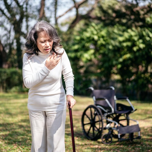 A Woman In A White Shirt Using A Cane For Support, Illustrating Mobility Assistance And Gait Training During Physiotherapy Edmonton At In Step Physical Therapy. A Woman In A White Shirt Using A Cane For Support, Illustrating Mobility Assistance And Gait Training During Physiotherapy Edmonton At In Step Physical Therapy.