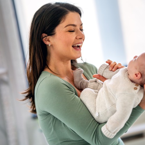 A Happy Family Sharing A Close Moment, Illustrating The Goal Of Returning To Active Parenthood And Family Life Through Physiotherapy Edmonton At In Step Physical Therapy. A Happy Family Sharing A Close Moment, Illustrating The Goal Of Returning To Active Parenthood And Family Life Through Physiotherapy Edmonton At In Step Physical Therapy.