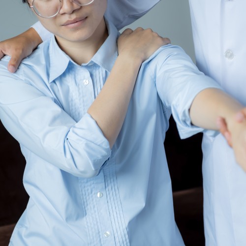 A Physiotherapist Providing Manual Therapy To A Patient&Amp;Apos;S Back And Spine During A Physiotherapy Edmonton Session At In Step Physical Therapy. A Physiotherapist Providing Manual Therapy To A Patient&Amp;Apos;S Back And Spine During A Physiotherapy Edmonton Session At In Step Physical Therapy.