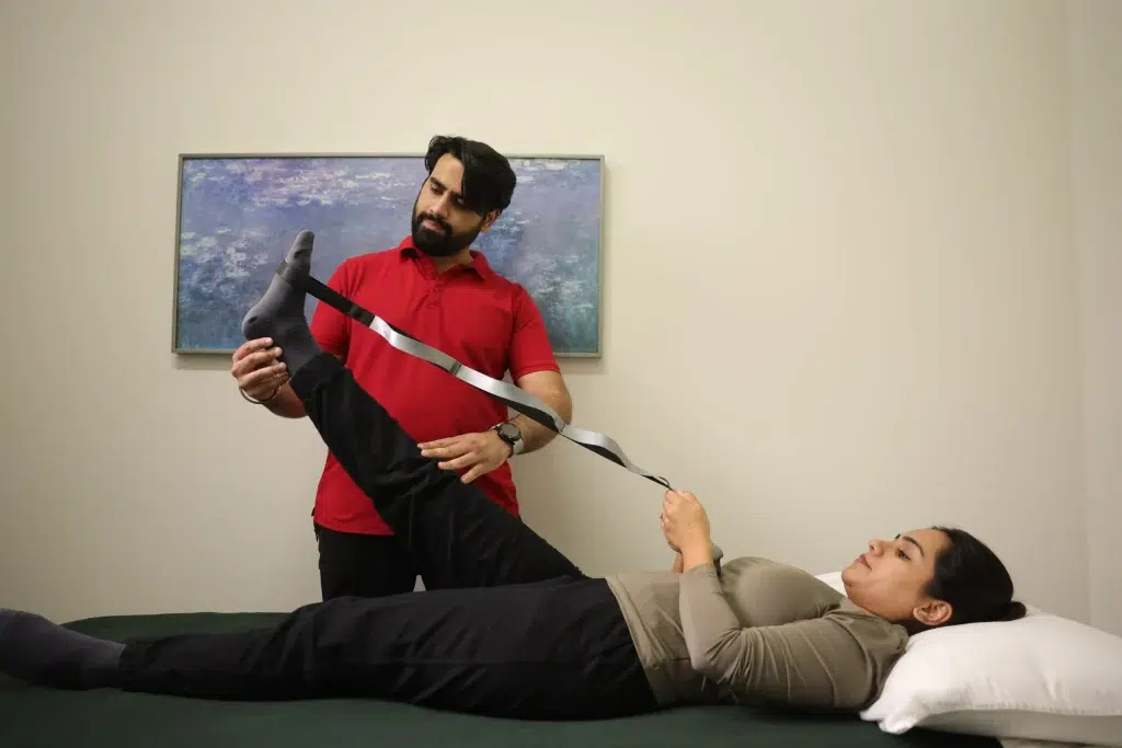 Physiotherapist Assessing An Athlete At In Step Physical Therapy Edmonton